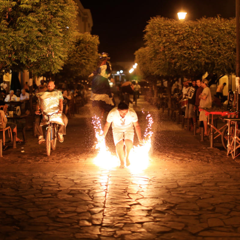 Man in Nicaragua holding sparkler on street